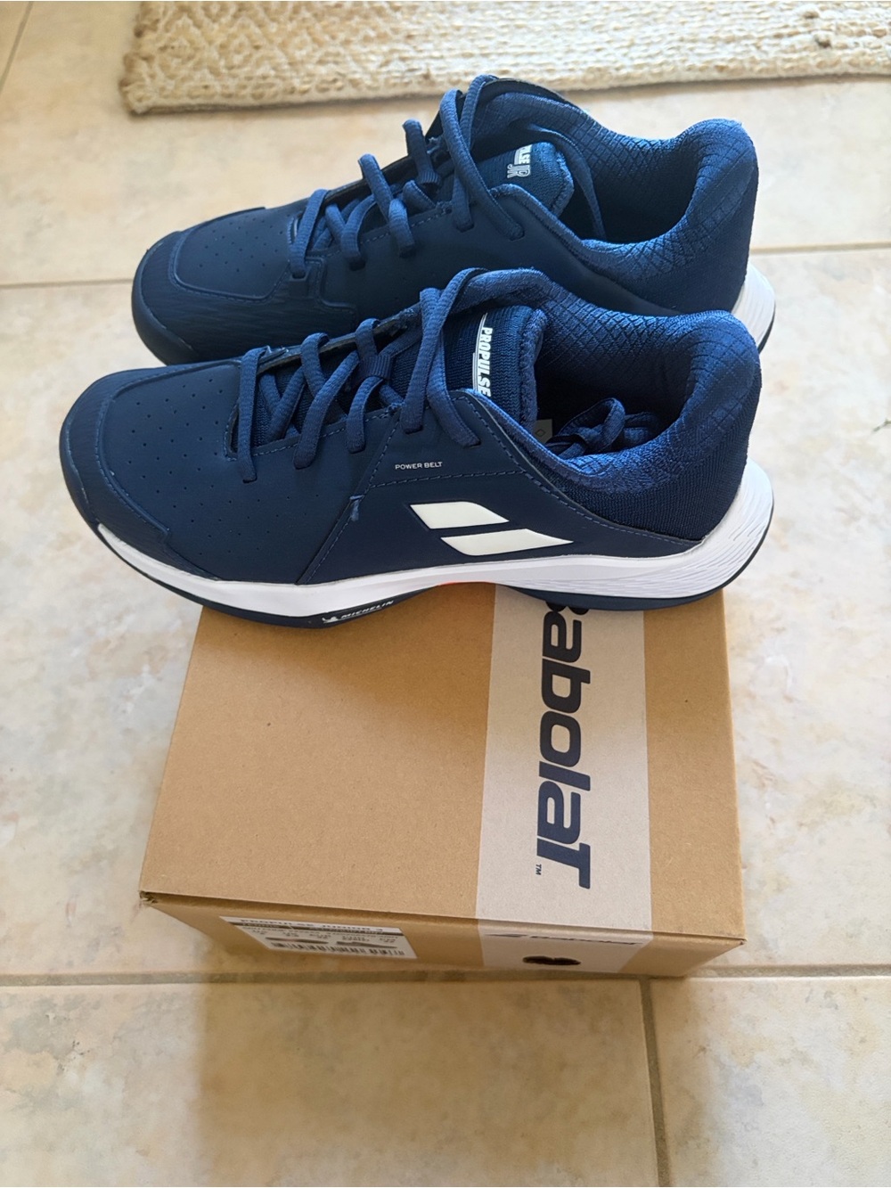 BRAND NEW! Babolat kids tennis shoes. Propose Junior All Court. Size 4.